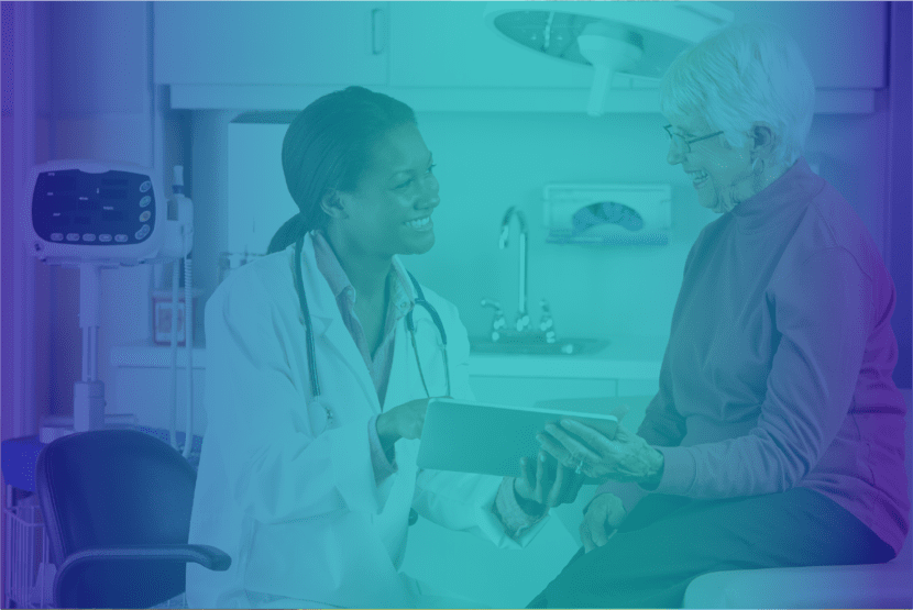 A doctor and patient in a room with lights.